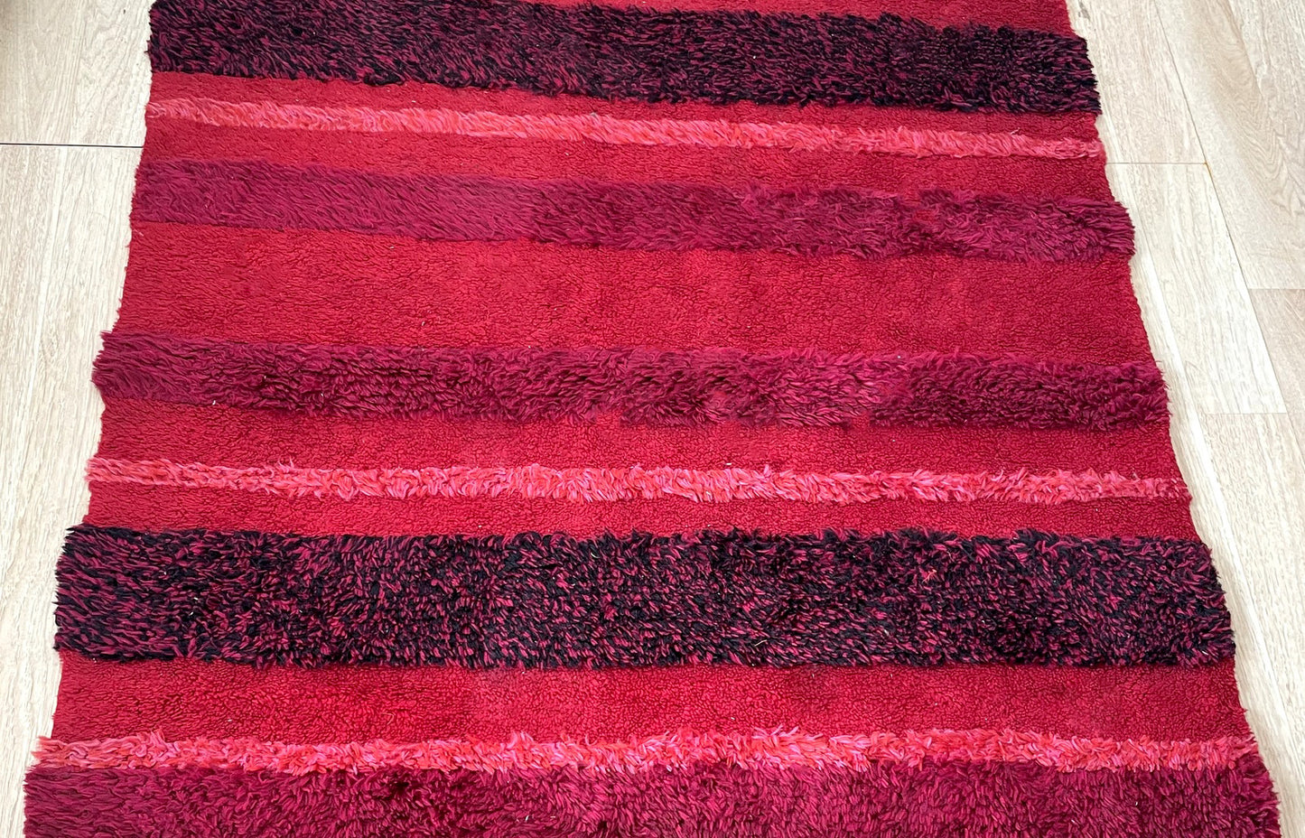 Close-up of authentic Swedish Rya rug showcasing painterly abstract design and hand-knotted Ghiordes knots

