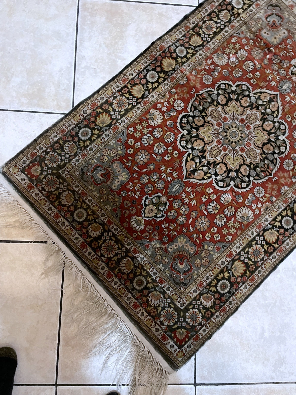 Exquisite Indian silk rug with brilliant natural luster and dense low pile changing tone with light on display

