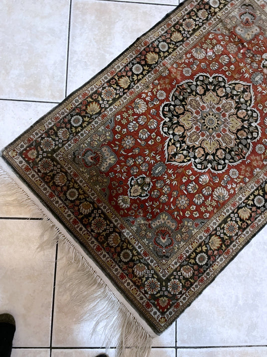 Exquisite Indian silk rug with brilliant natural luster and dense low pile changing tone with light on display

