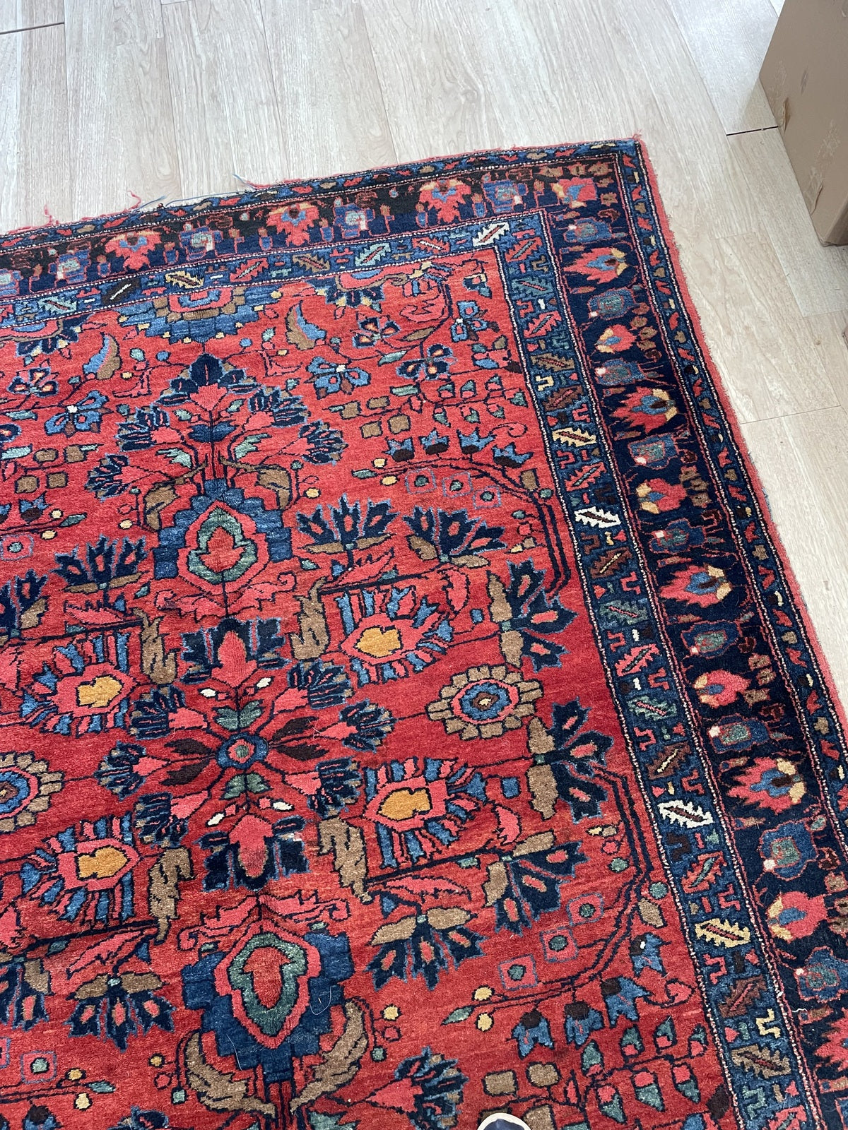 Handwoven Lilihan rug circa 1910-1915 with salmon-rose navy indigo sky blue cream and ochre colors

