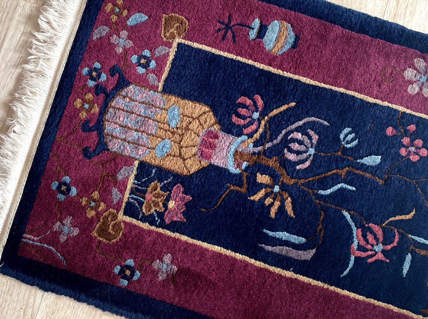 Texture detail of high-quality lustrous wool on a 100-year-old Chinese rug with thick heavy-set weave