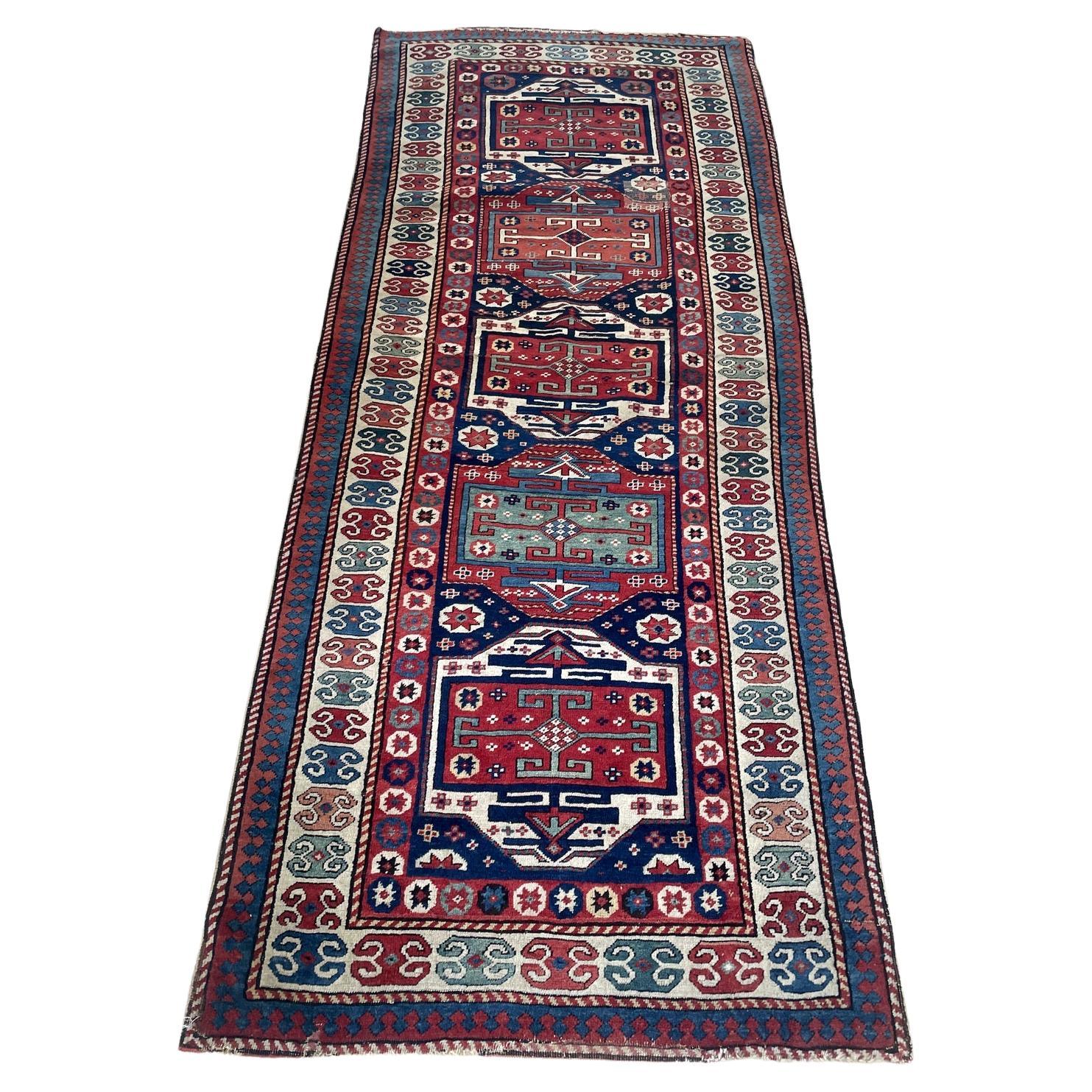 Antique Caucasian Kazak runner 1880s hand-knotted wool 3.2x8 ft full view with striking sequence of geometric medallions

