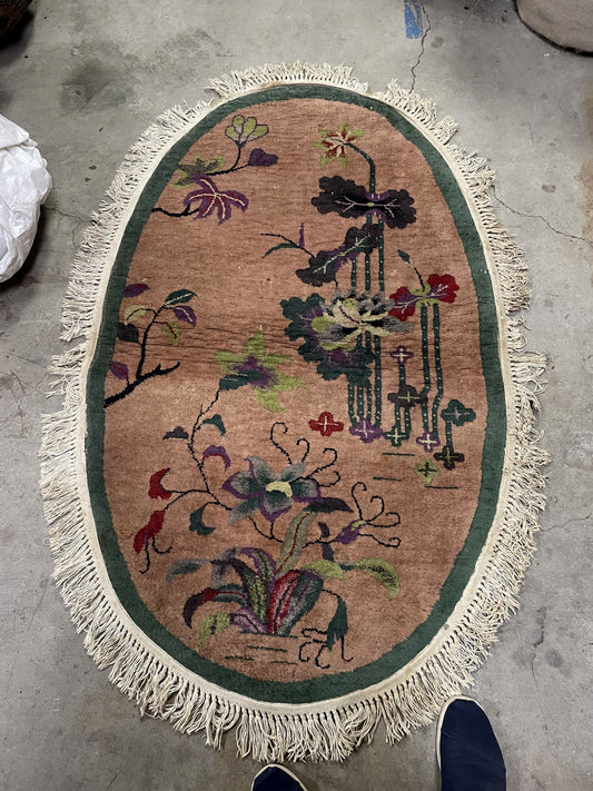 Chinese Art Deco rug full view, oval vintage wool carpet with soft color palette