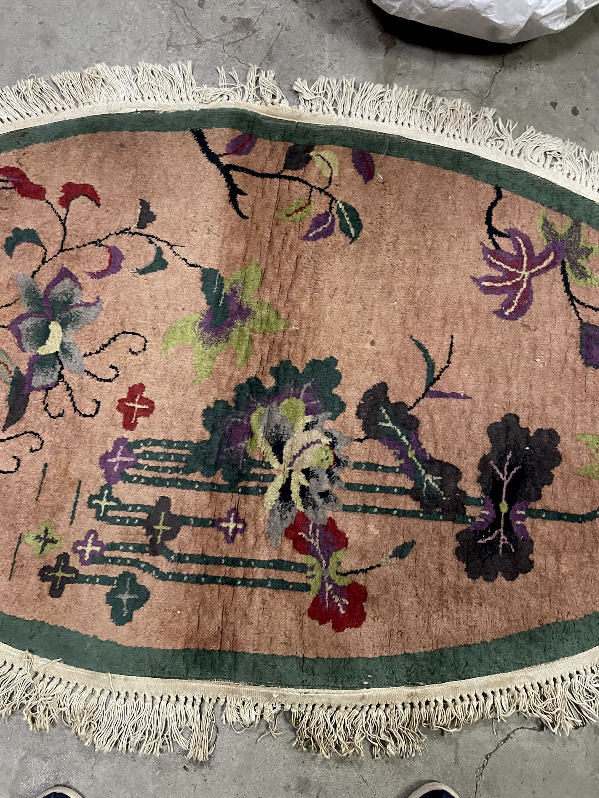 Vintage Chinese wool rug detail, stylized floral branches and decorative elements