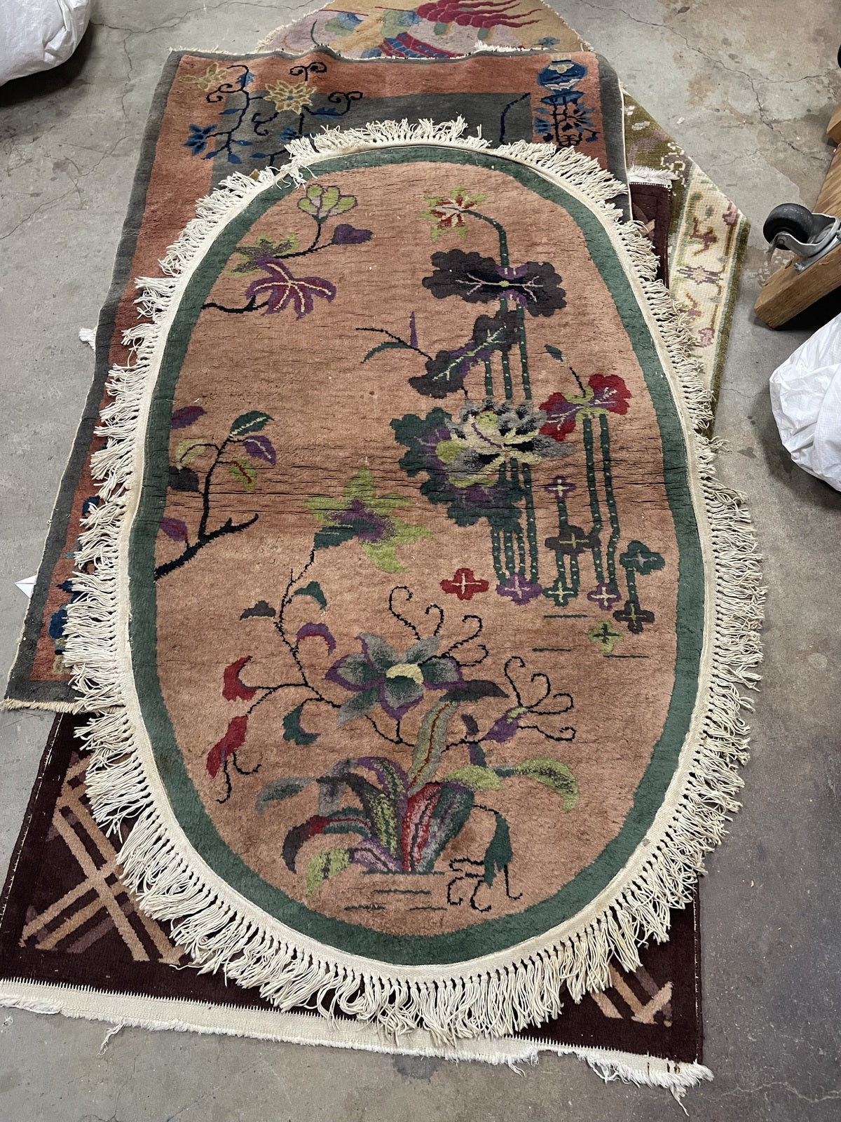 Antique Chinese Art Deco oval rug corner detail, showcasing craftsmanship and patina