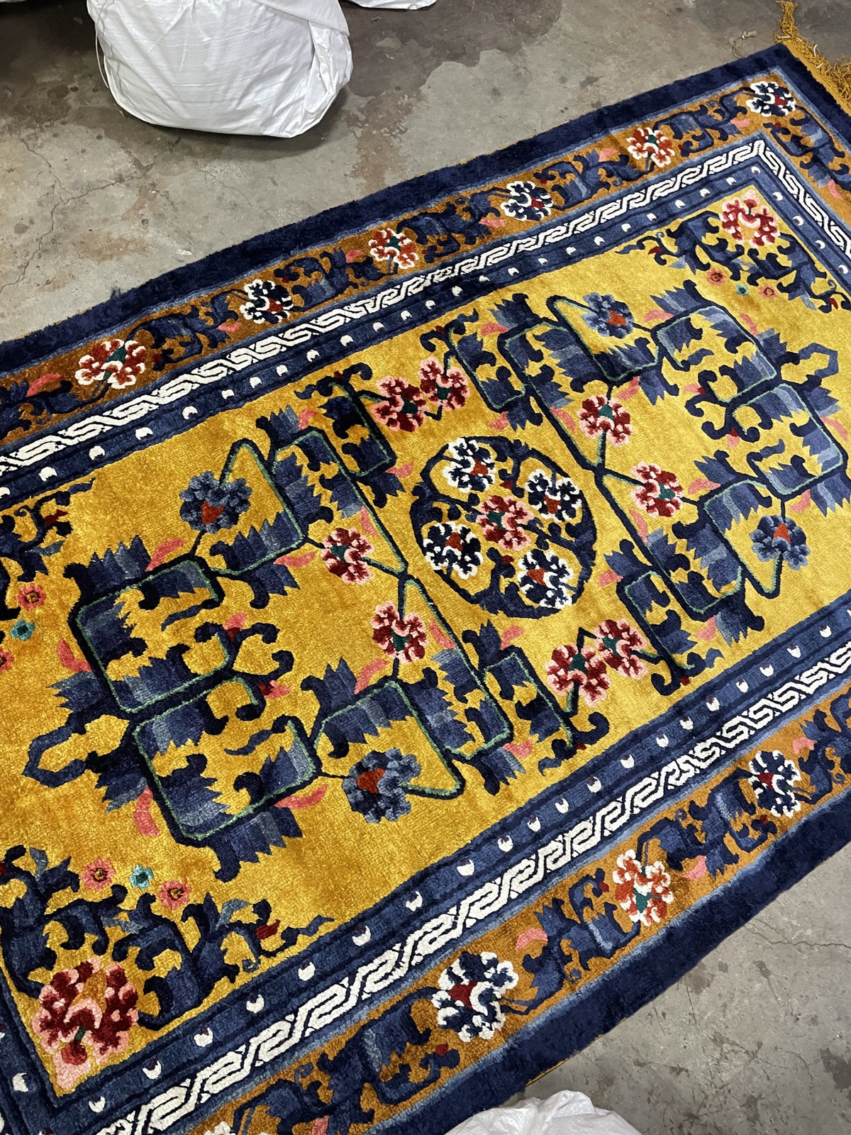 Vintage Chinese Art Deco rug close-up, silk texture with luminous sheen