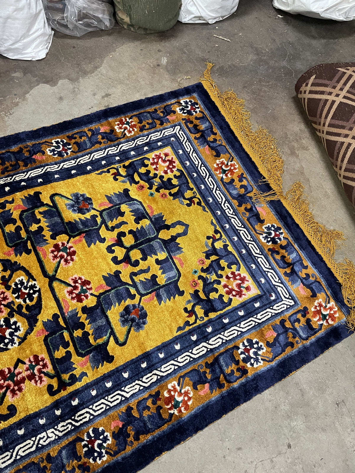 1950s Chinese silk rug, yellow field with floral medallion and geometric layout