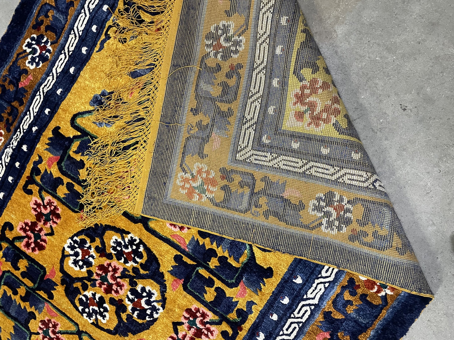 Chinese Art Deco silk rug detail, stylized floral patterns and rich colors