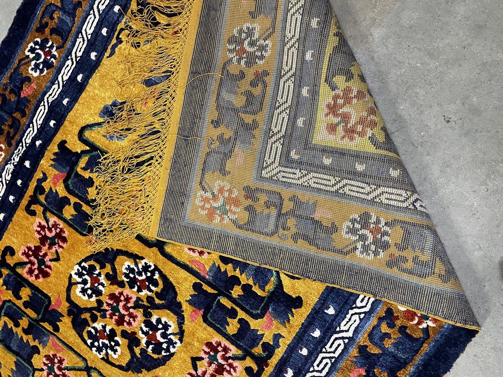 Chinese Art Deco silk rug detail, stylized floral patterns and rich colors
