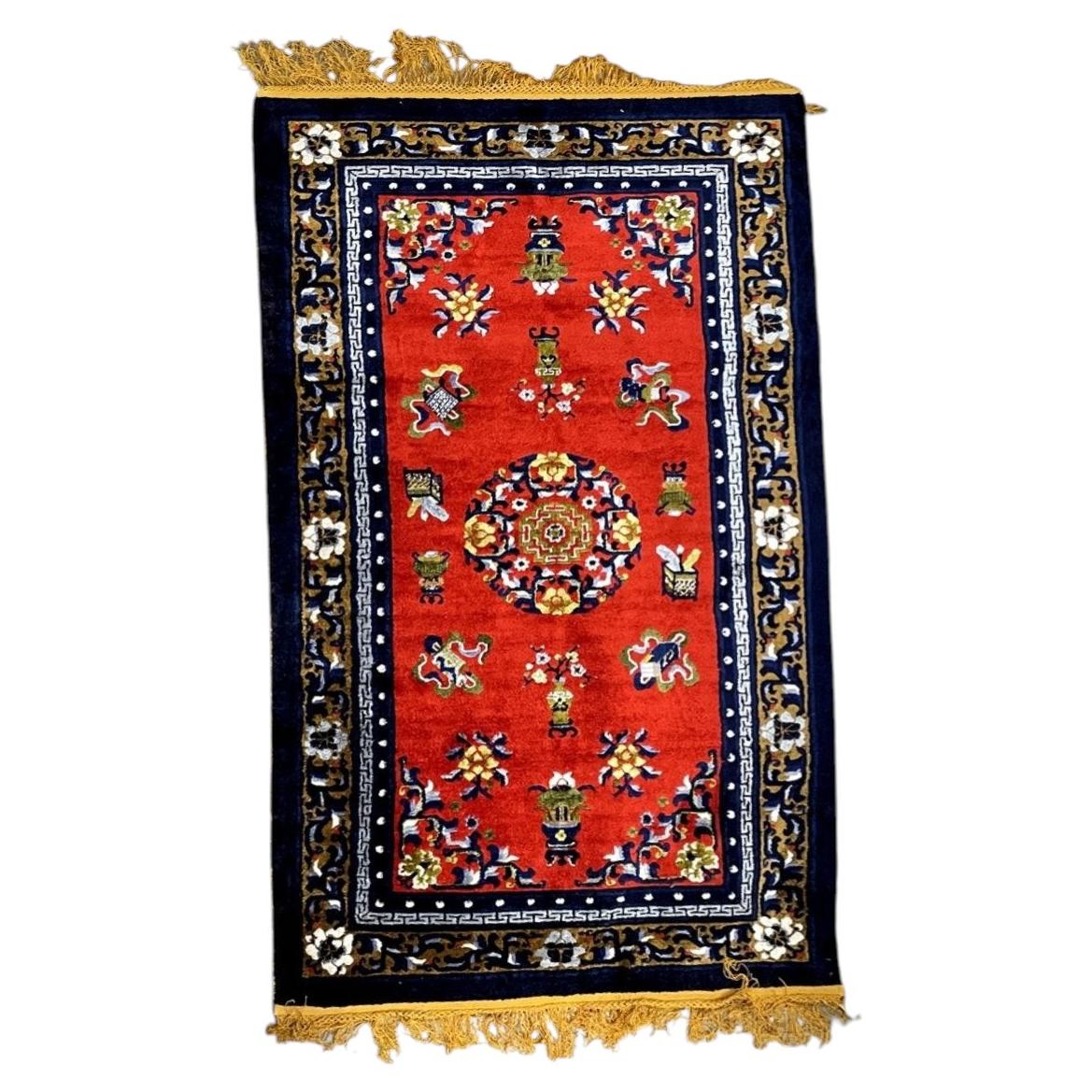 Vintage Chinese Art Deco silk rug, red field with floral motifs and soft sheen