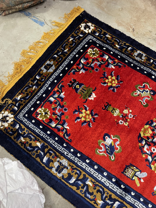 Handmade Chinese silk rug full view, deep red field with elegant floral design