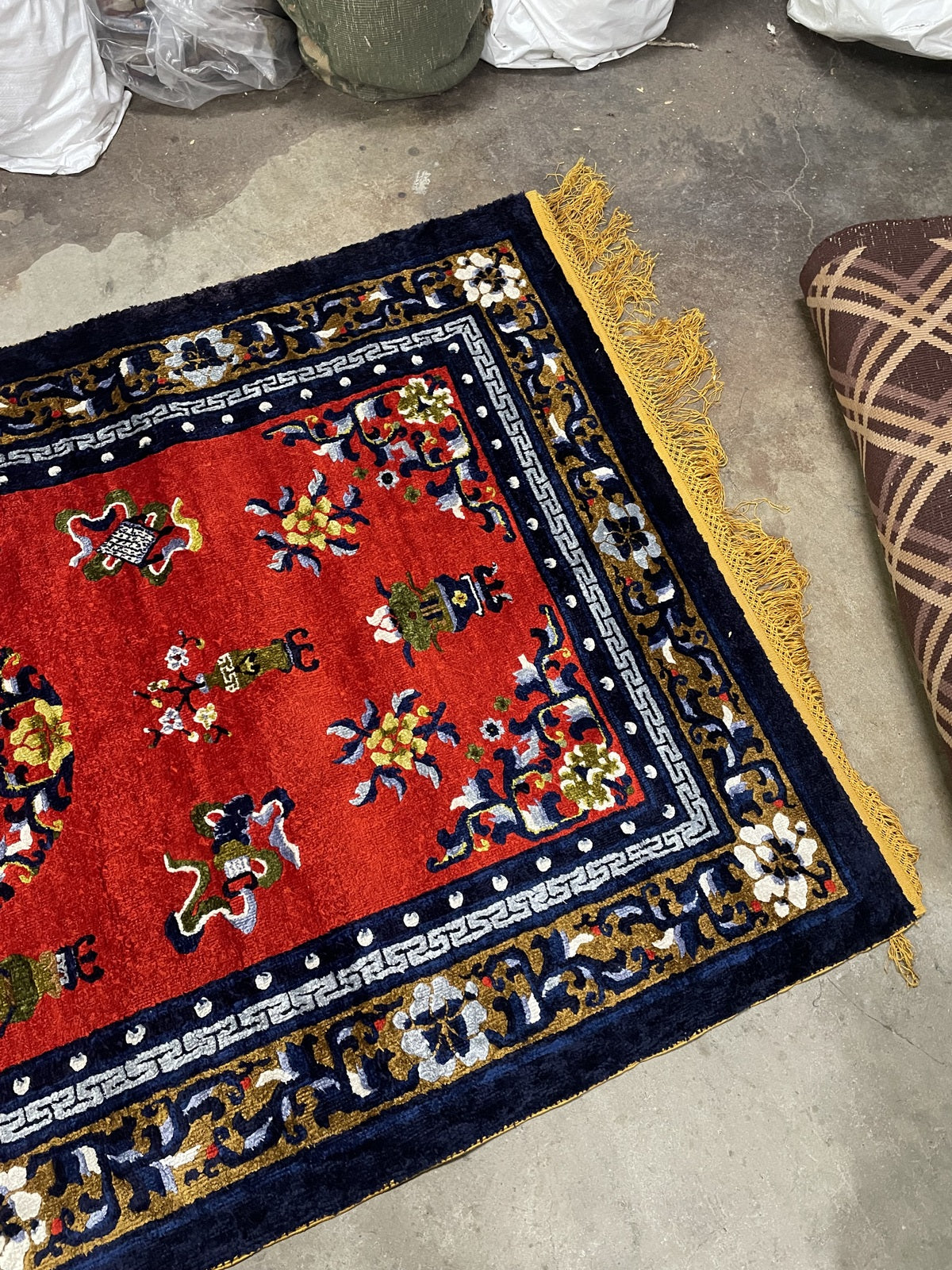 1950s Chinese silk rug, red field with floral medallion and decorative border