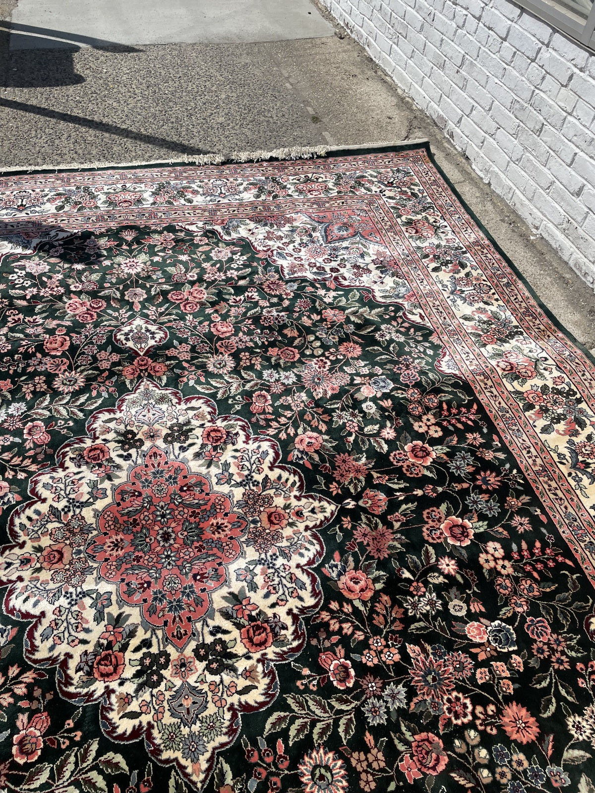 Chinese silk rug detail, blossoming flowers and botanical motifs on green field