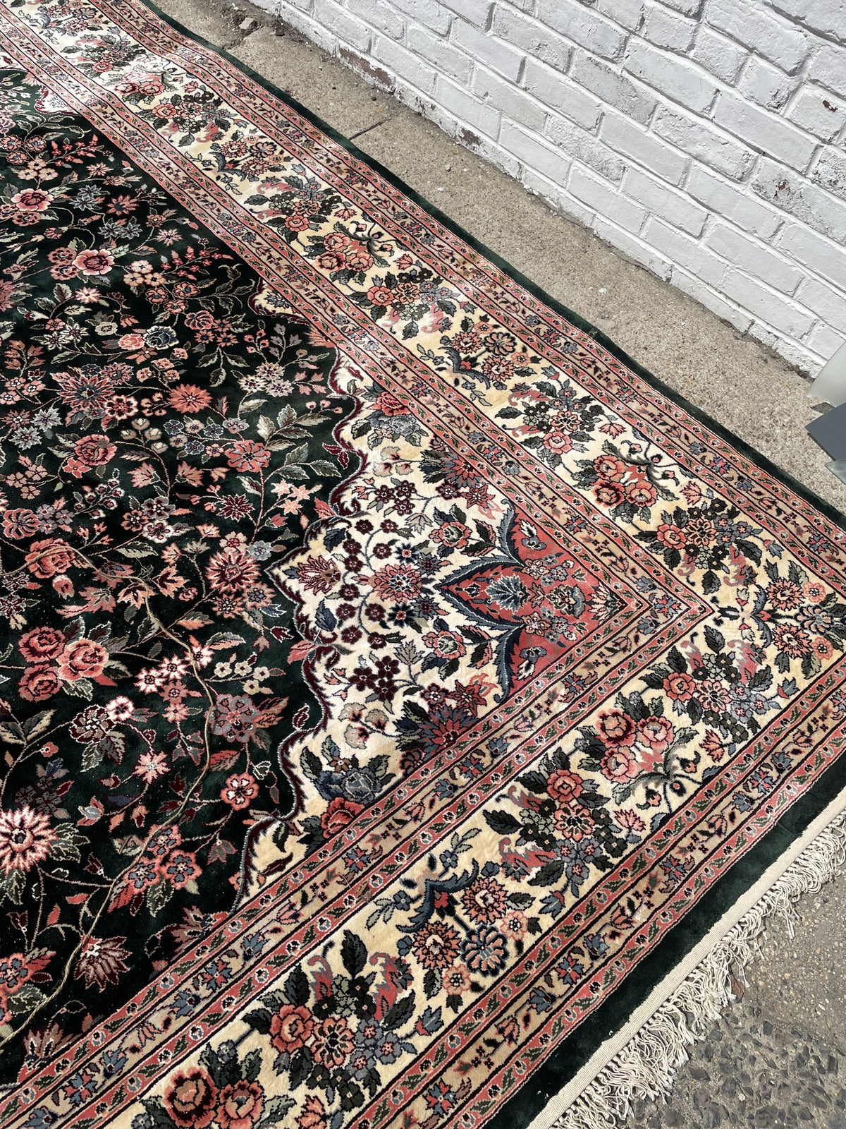 Vintage Chinese silk carpet, deep green field with coral and ivory floral elements