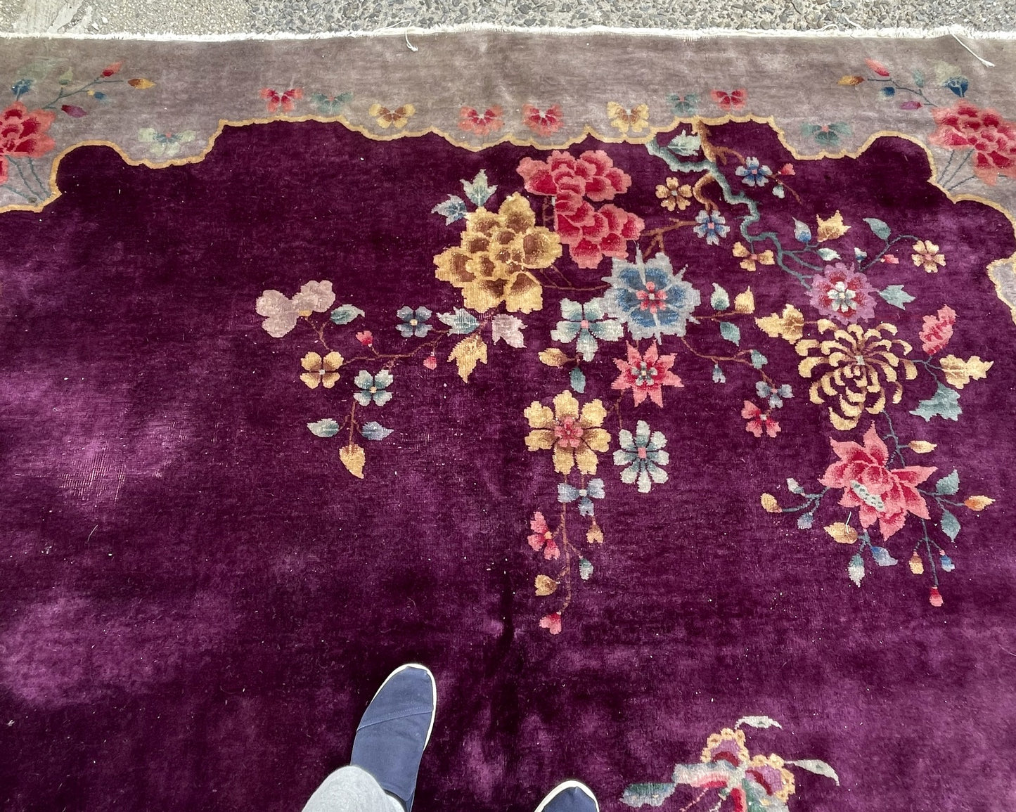 Antique hand-knotted Chinese Art Deco rug circa 1920s in fair/good condition, showing honest age wear and some areas of low pile, with vivid colors throughout.

