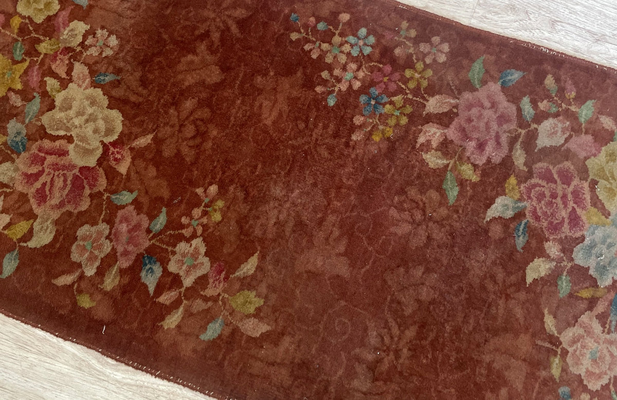 Folded corner revealing the floral patterned reverse