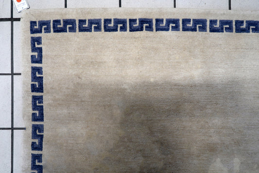 Close-up of intricate dragon design on handmade vintage Tibetan Khaden rug