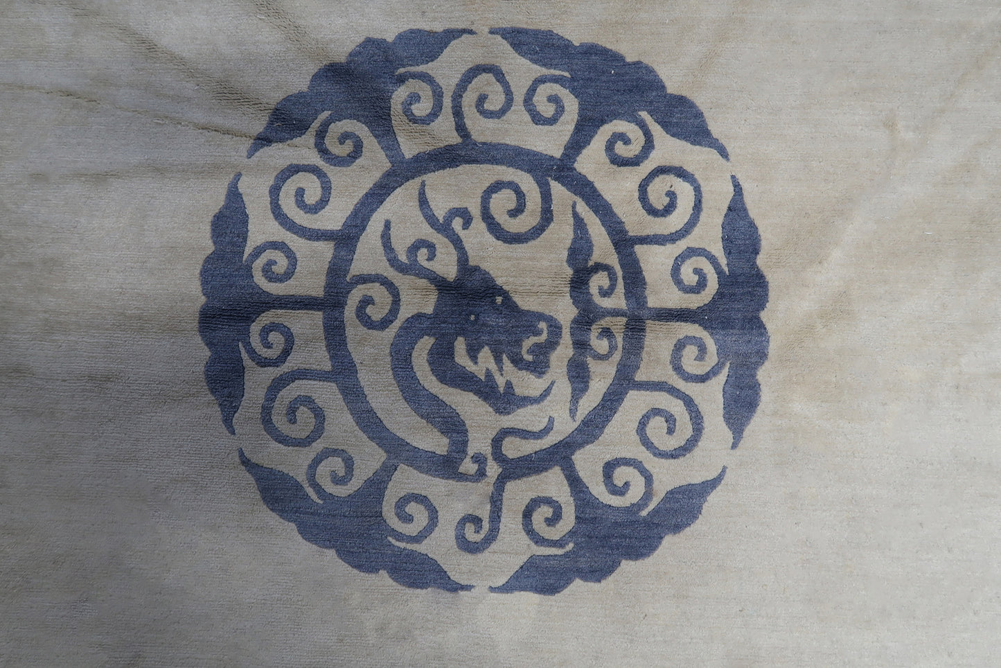 Beige and blue color scheme of the handmade vintage Tibetan Khaden rug