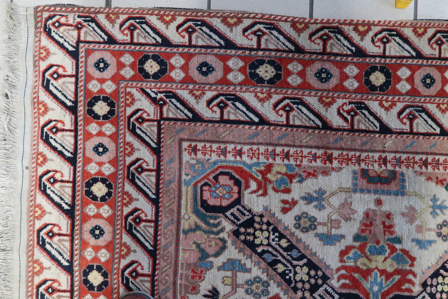 Close-up of intricate pattern and bright colors on handmade vintage Caucasian Zeyhur rug