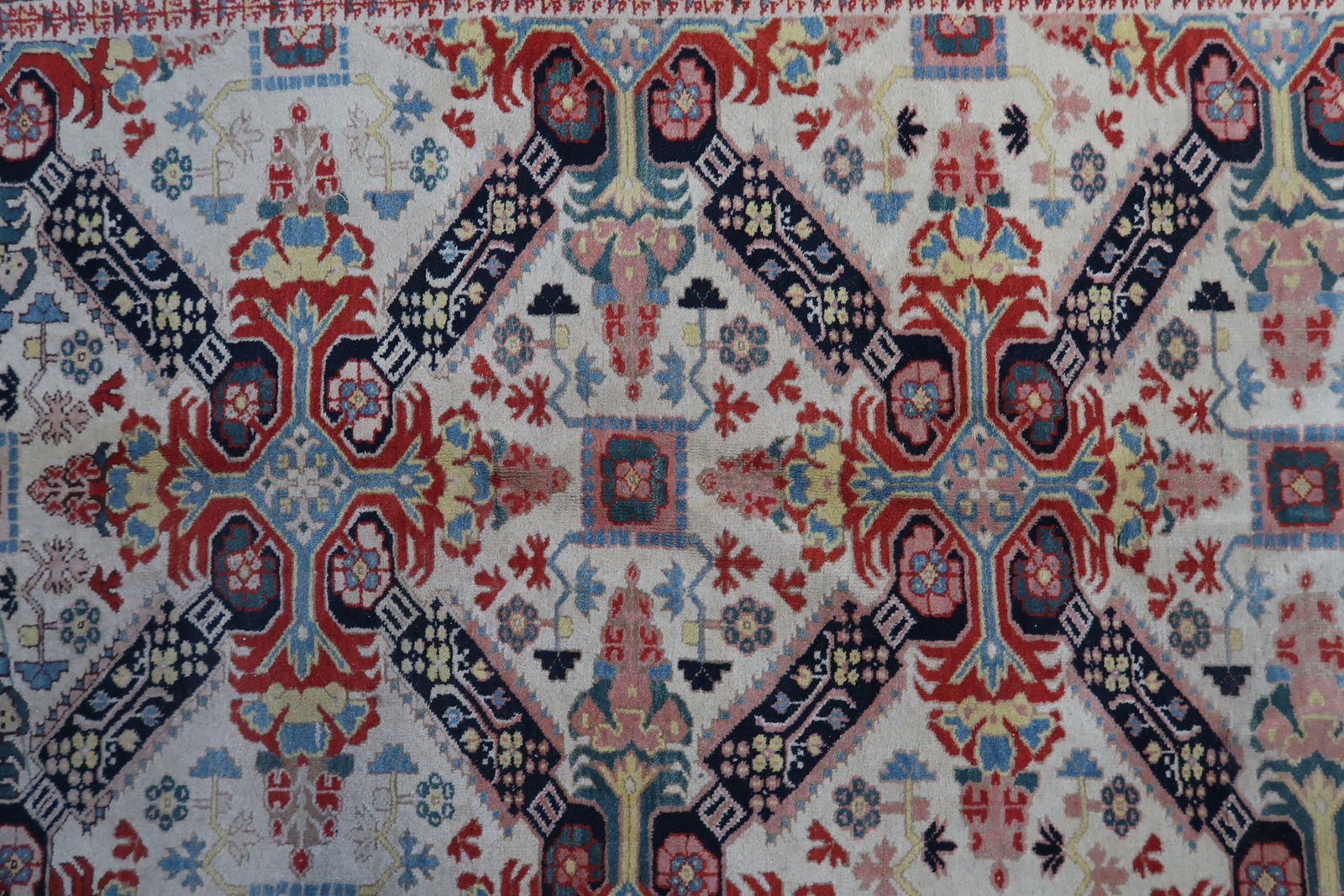 Detailed picture highlighting the 1950s vintage character of the handmade Caucasian Zeyhur rug