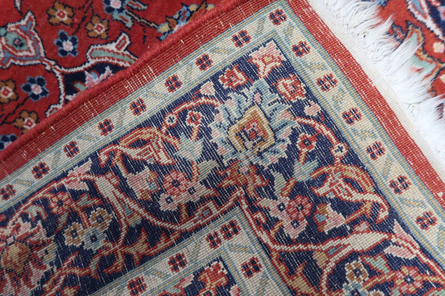  Back view of the handmade antique Persian Kashan rug showcasing its original good condition and fine craftsmanship.