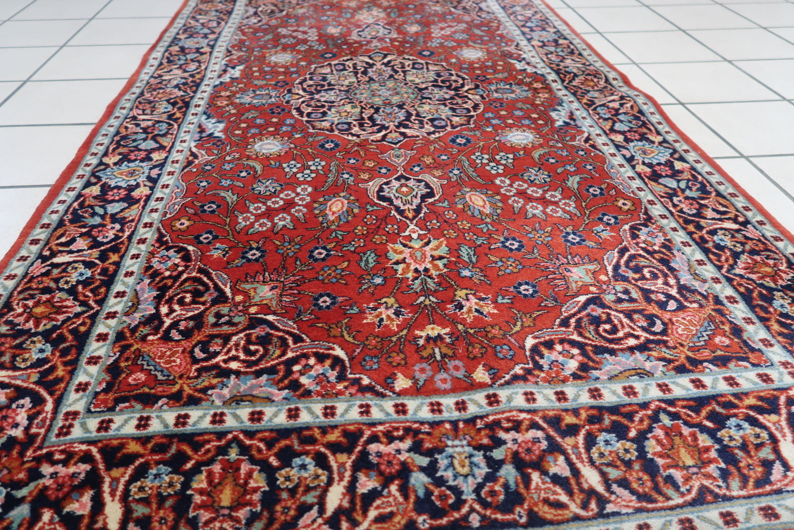 Detailed picture showcasing the historical significance and cultural heritage of the antique Persian Kashan rug.
