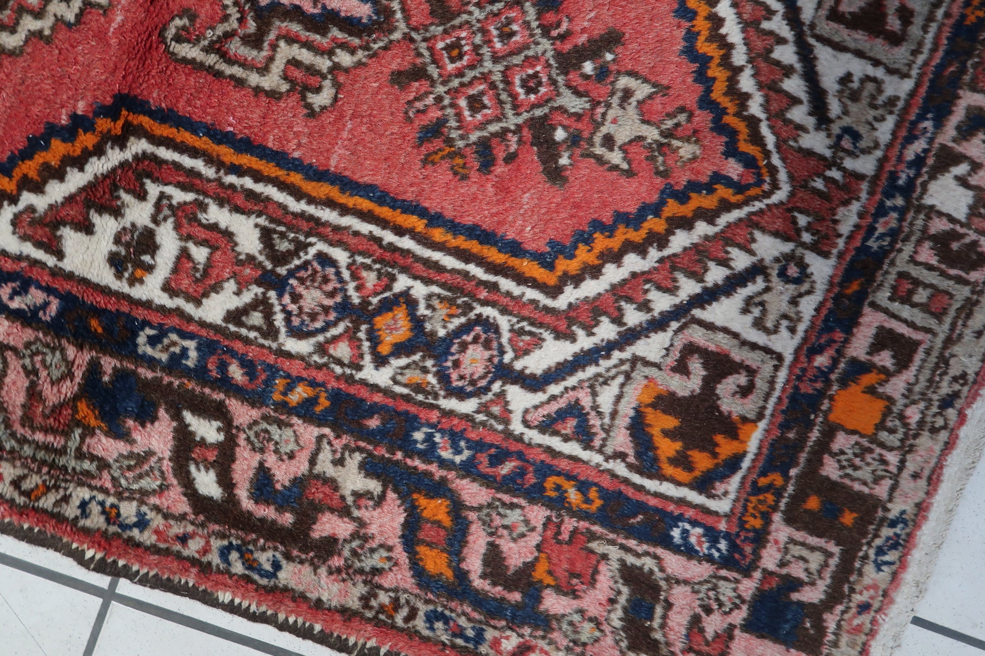 Detailed shot highlighting the intricate patterns and craftsmanship of the Persian Hamadan rug