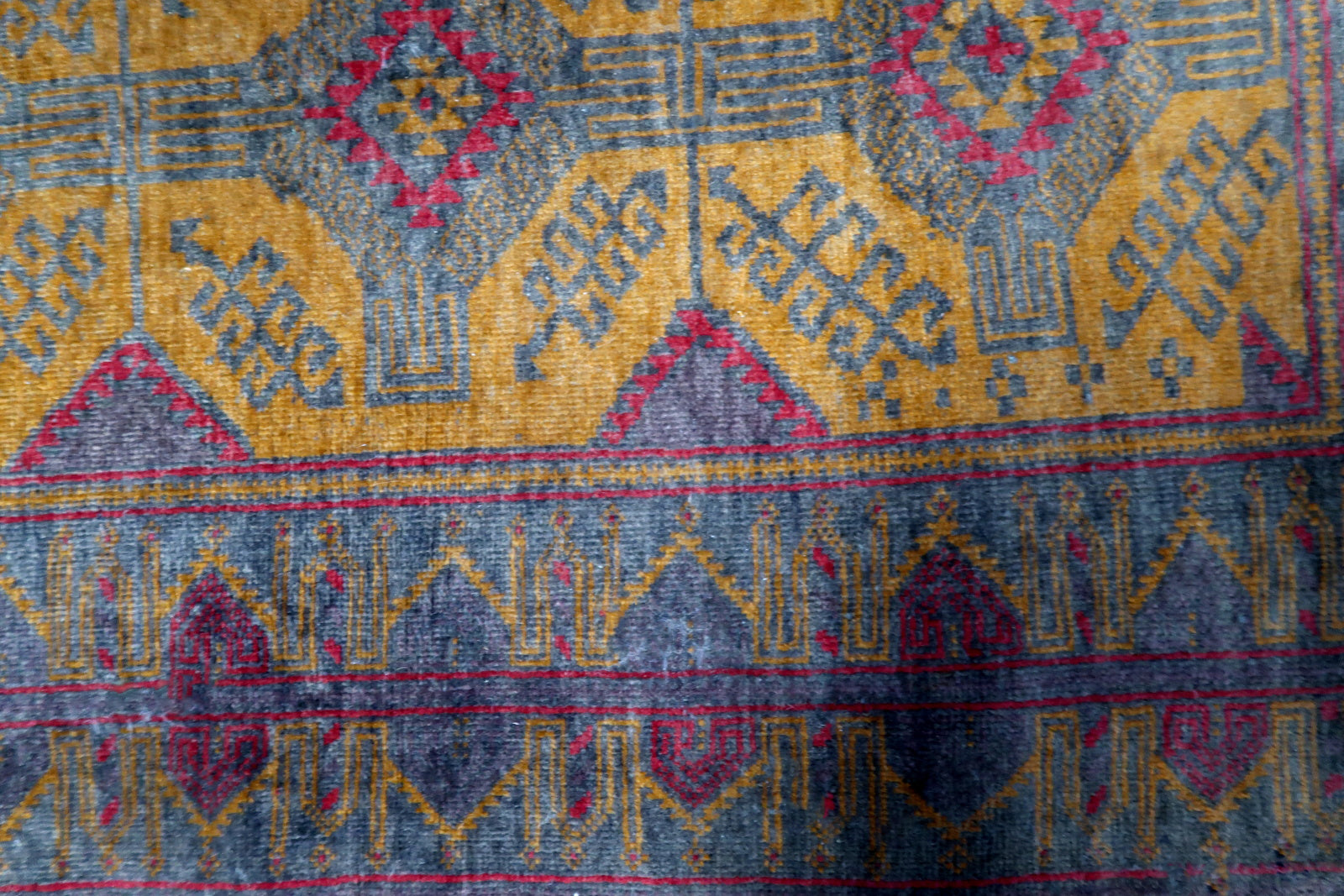 Fine craftsmanship and attention to detail on the vintage Baluch rug