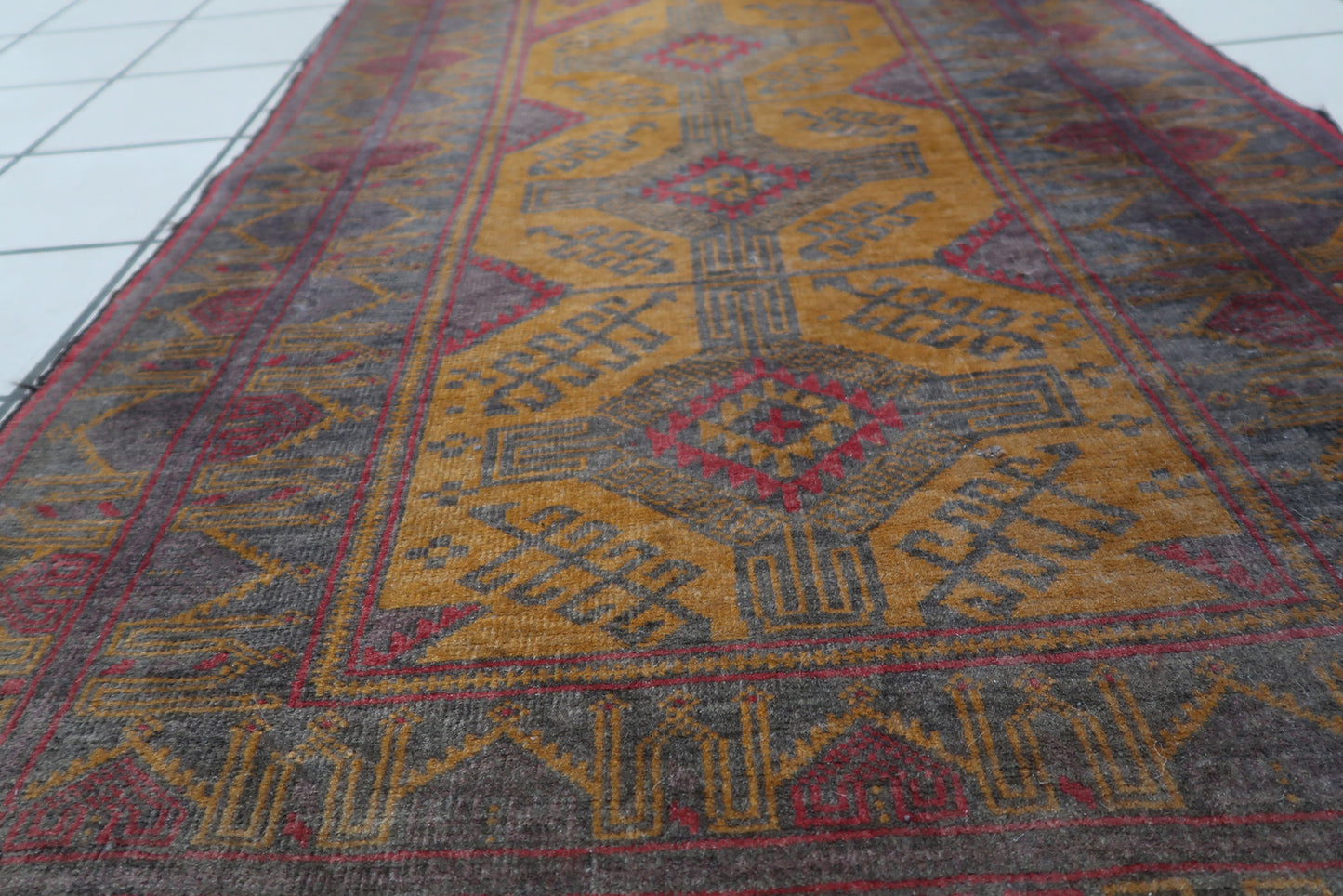 Intricate weaving and texture of the wool material on the Afghan Baluch rug