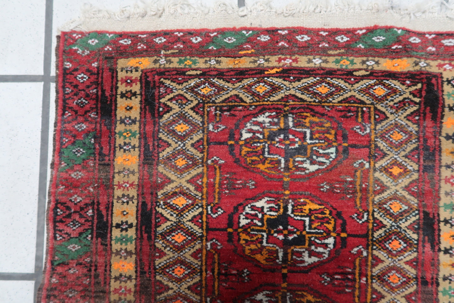 Detailed view of the wool material and craftsmanship of the Afghan Ersari mat