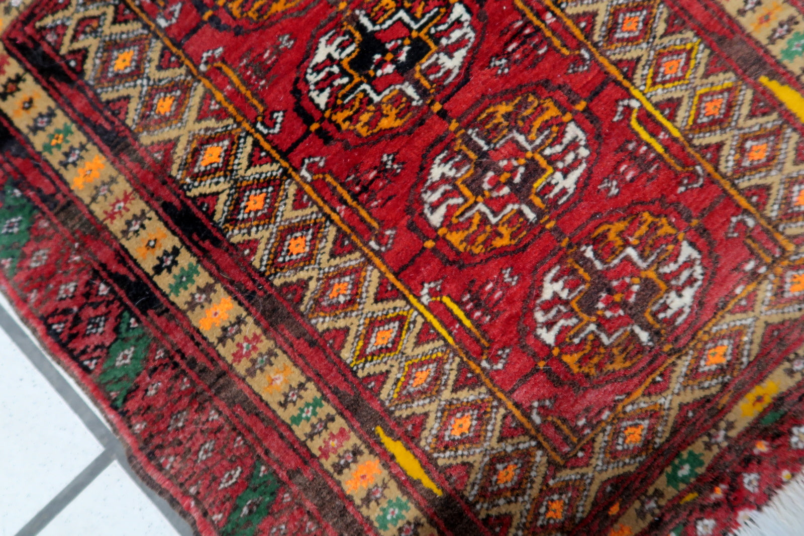 Close-up of the traditional Ersari style motifs on the vintage Afghan mat