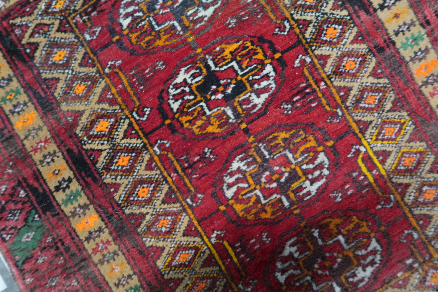 Intricate patterns and craftsmanship on the vintage Afghan Ersari mat