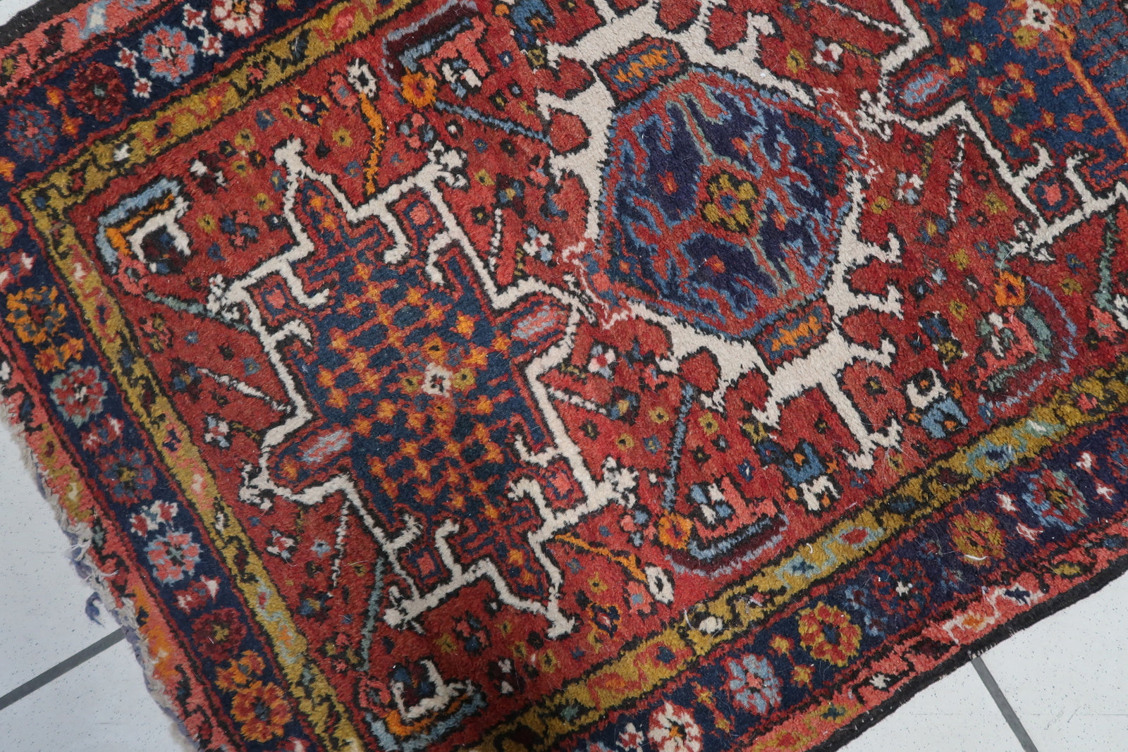 Close-up of the sky blue and navy blue colors on the Handmade Antique Persian Karajeh Rug