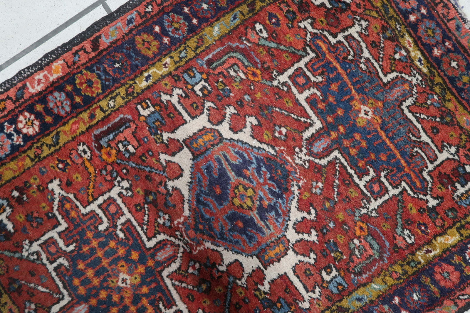 Close-up of the intricate weaving technique on the Handmade Antique Persian Karajeh Rug