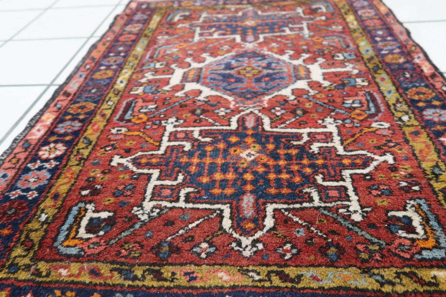 Close-up of the craftsmanship and fine details on the Handmade Antique Persian Karajeh Rug