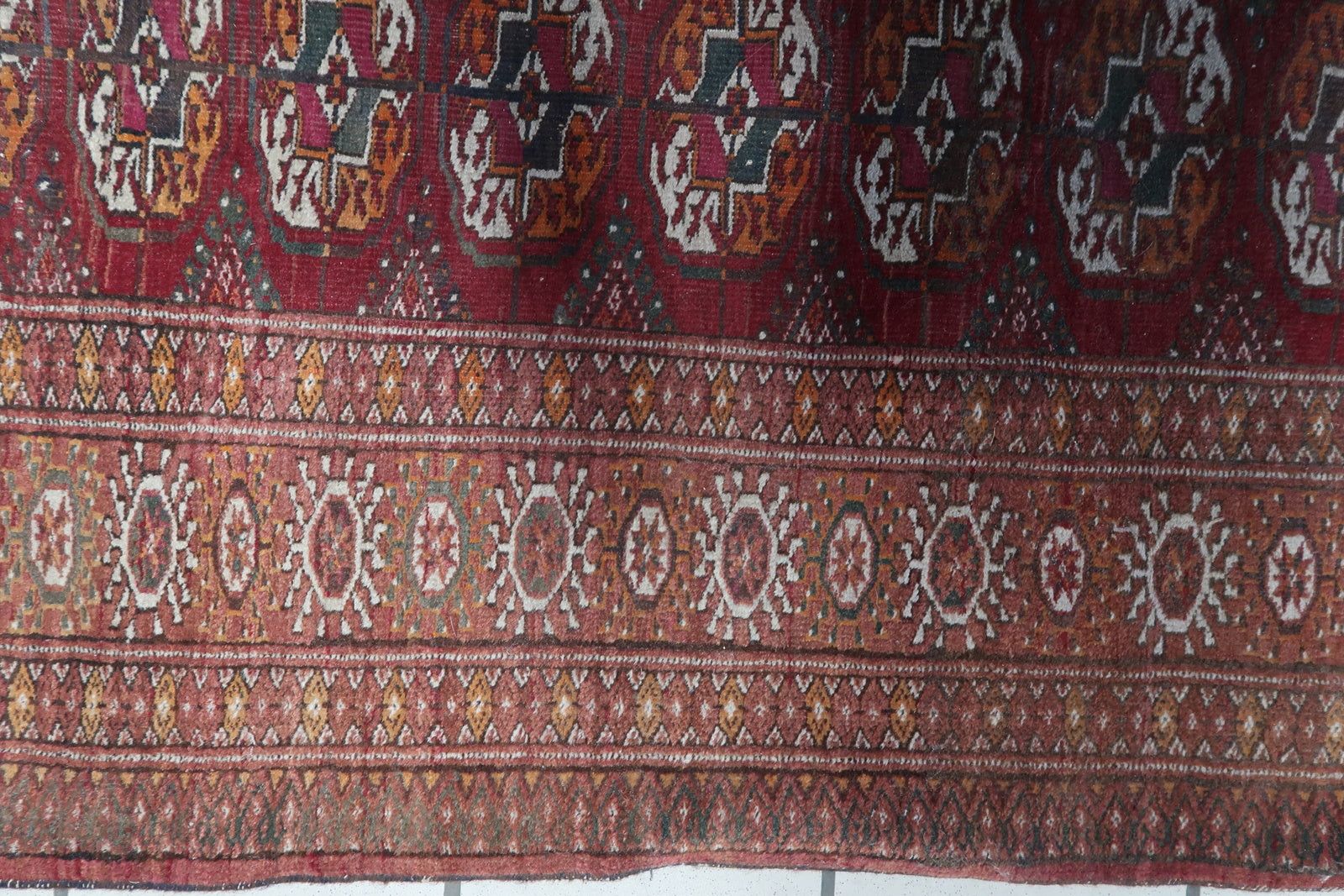 Intricate weaving and craftsmanship on the Handmade Vintage Uzbek Bukhara Rug