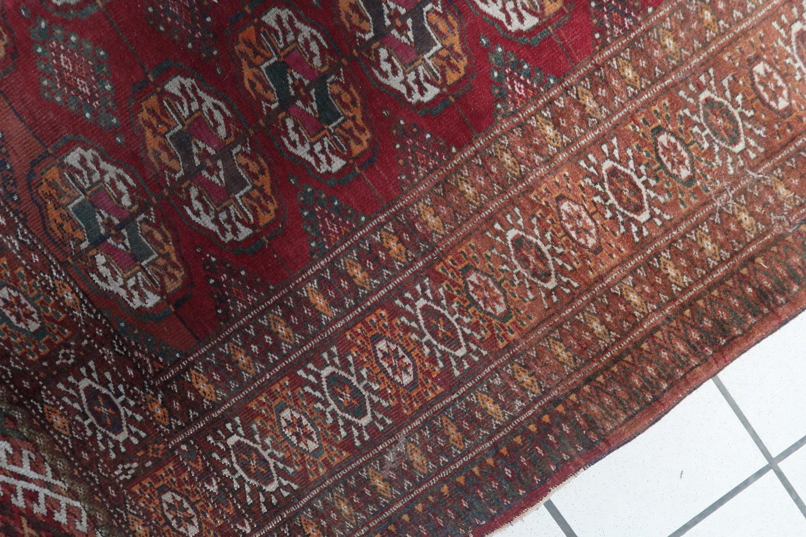 Close-up of the intricate patterns and color combinations on the Handmade Vintage Uzbek Bukhara Rug