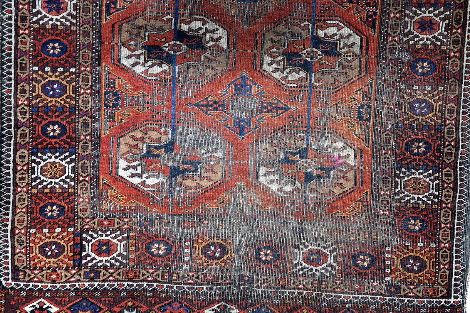 Detailed View of Red and Chocolate Brown Colors on Afghan Baluch Rug