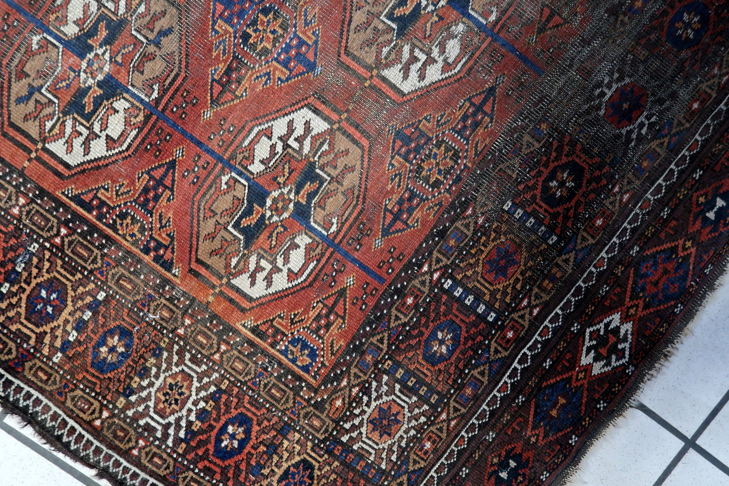 Close-up of Traditional Baluch Style Patterns on Afghan Rug