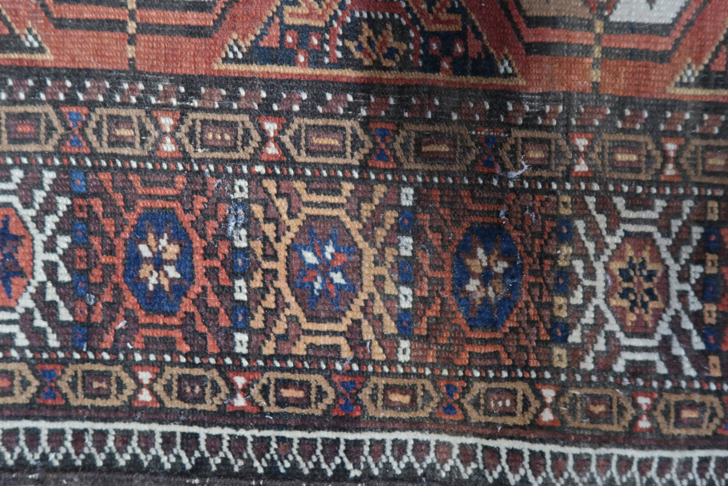 Detailed View of Woven Wool Material on Vintage Afghan Baluch Rug