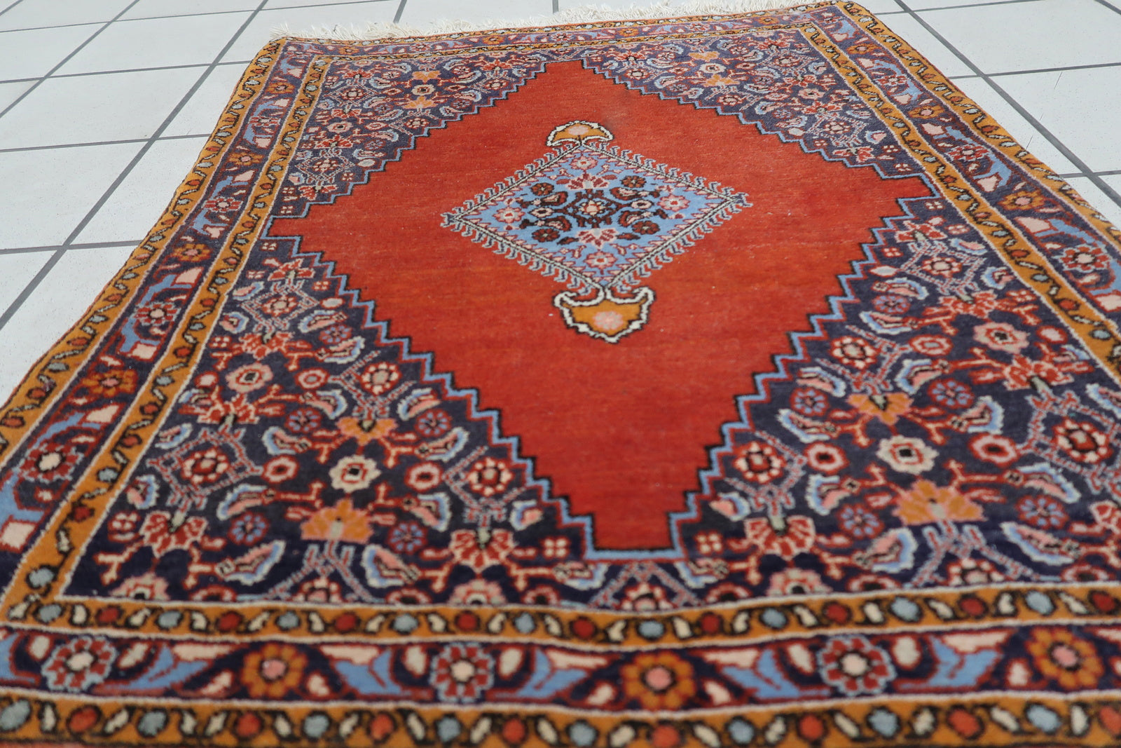 Contrast between red field and dark blue geometric elements

