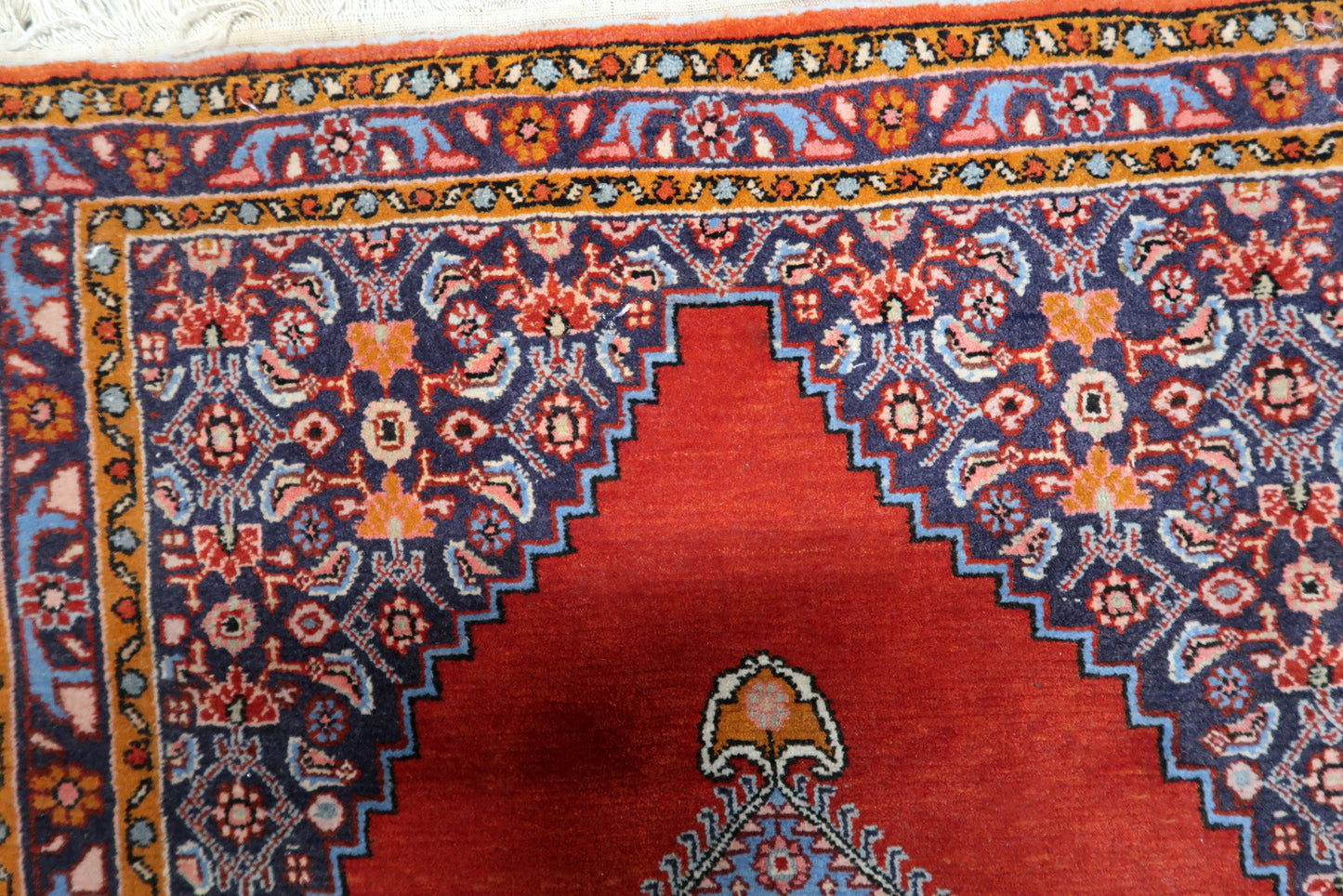 Detailed view of navy blue and sky blue patterns in medallion

