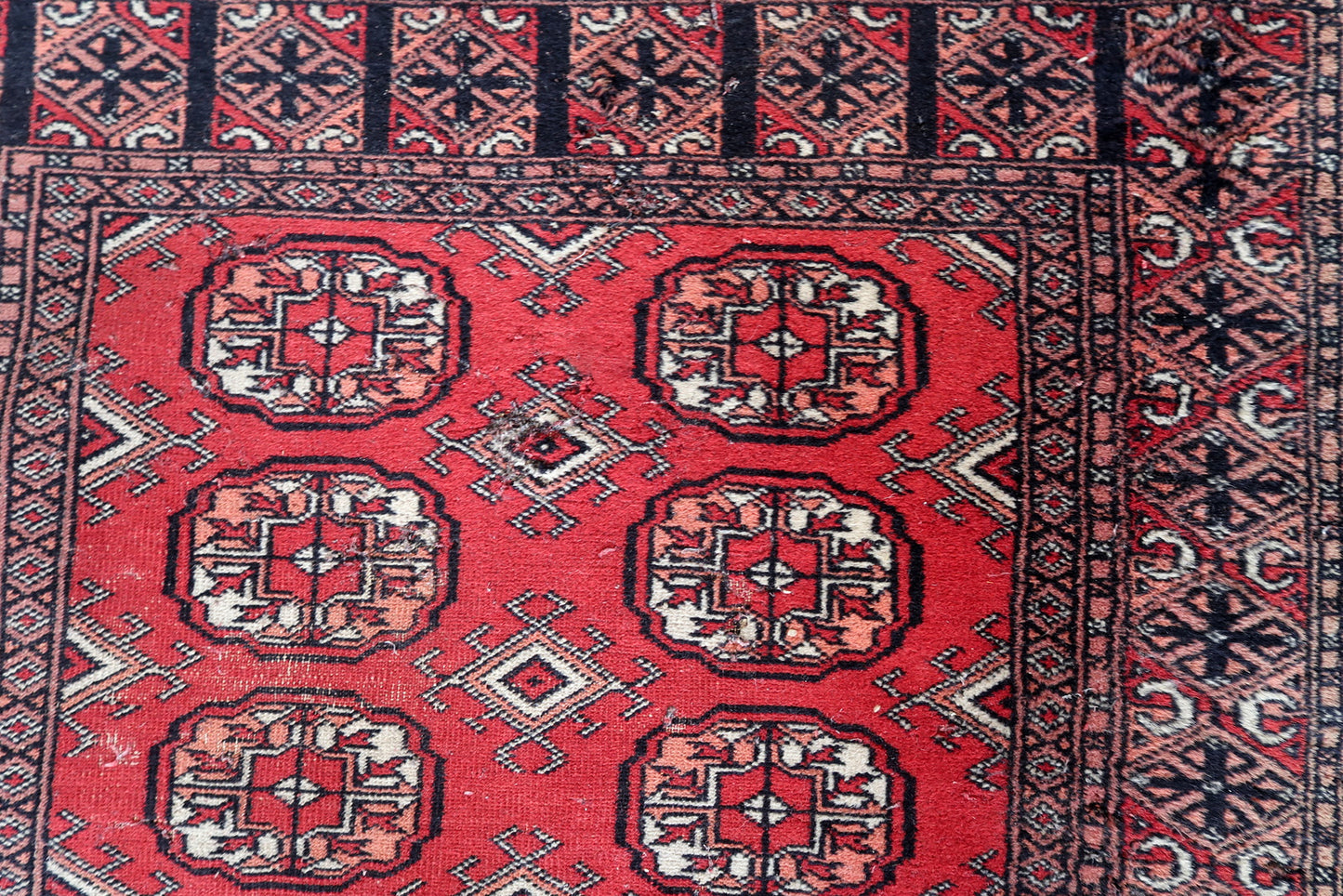 Intricate traditional design in beige and red.