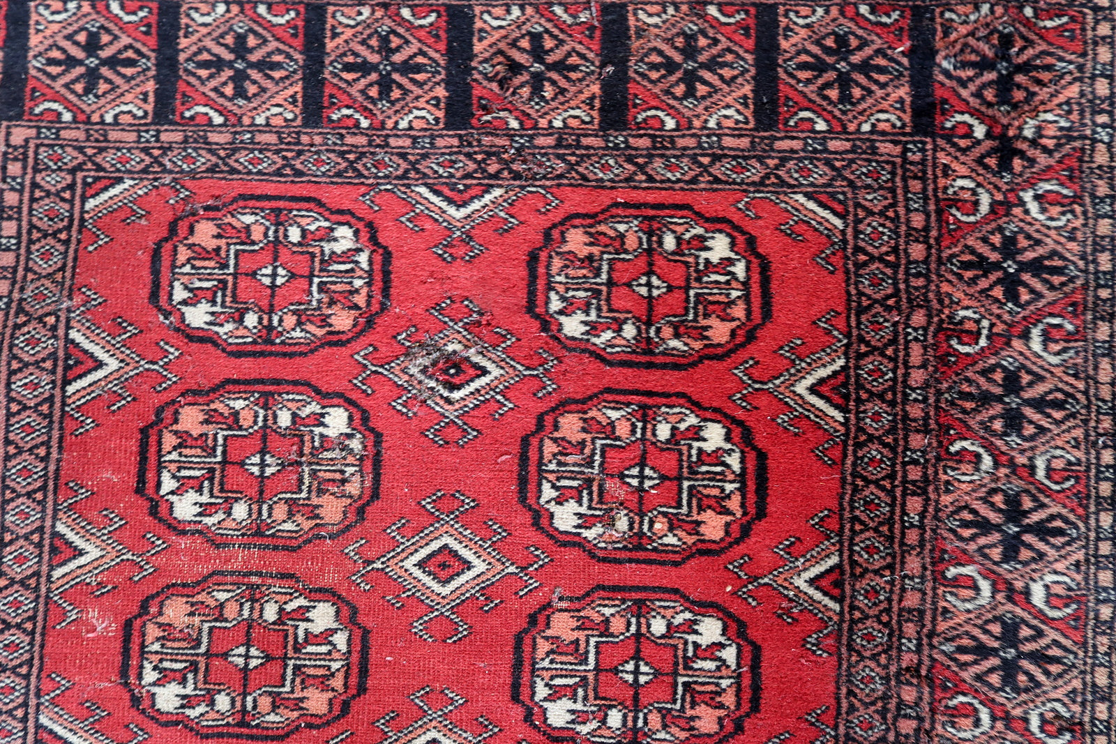 Intricate traditional design in beige and red.
