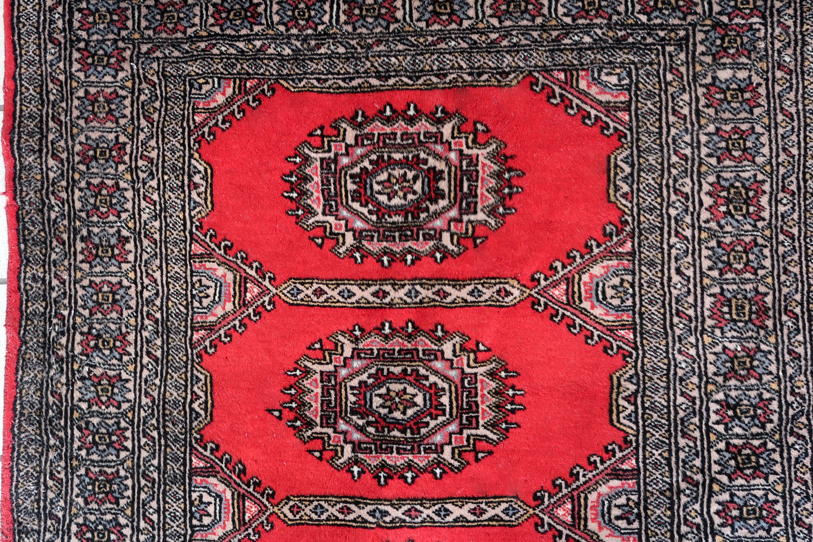 Intricate traditional design in beige and red.