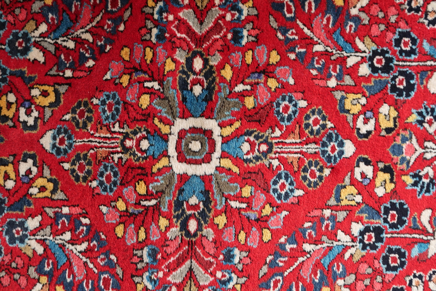Detailed floral motifs in navy blue and yellow.