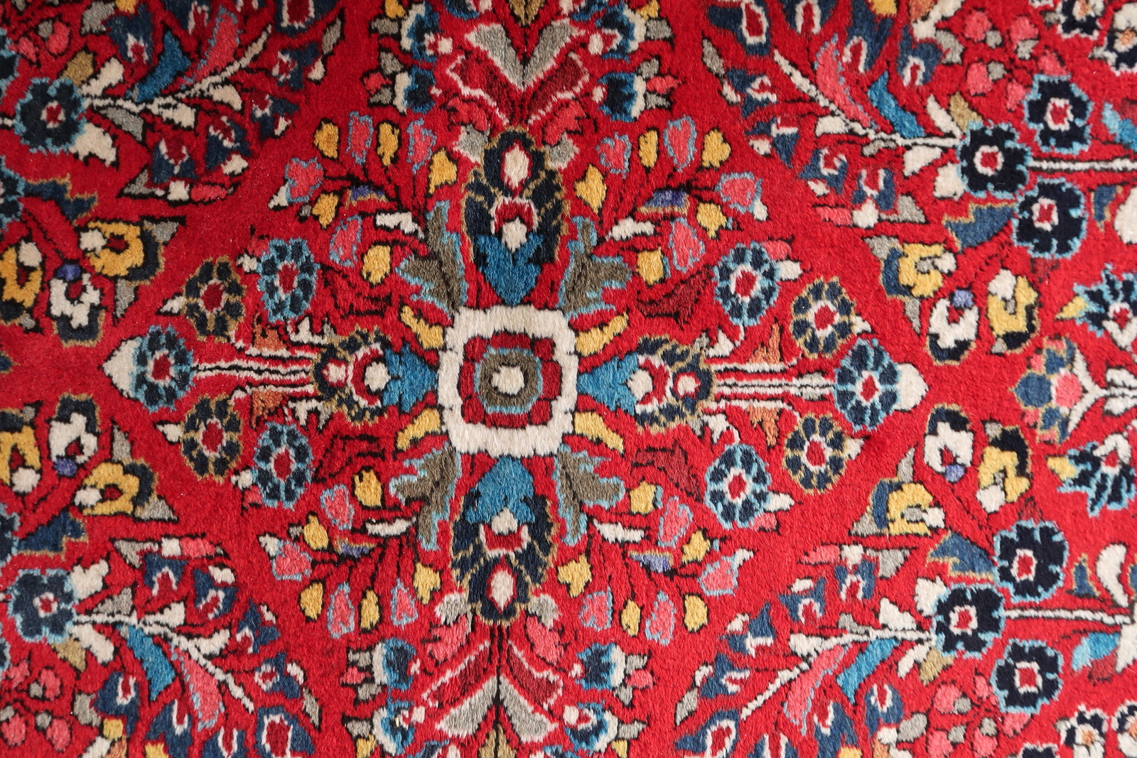 Detailed floral motifs in navy blue and yellow.