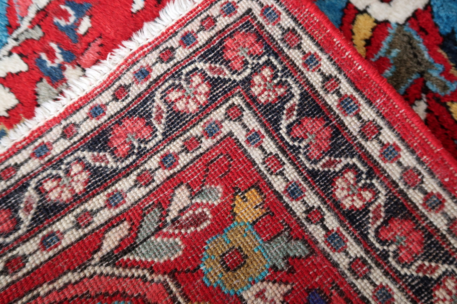 Back side of the Handmade Vintage Sarouk Rug, showcasing original good condition.