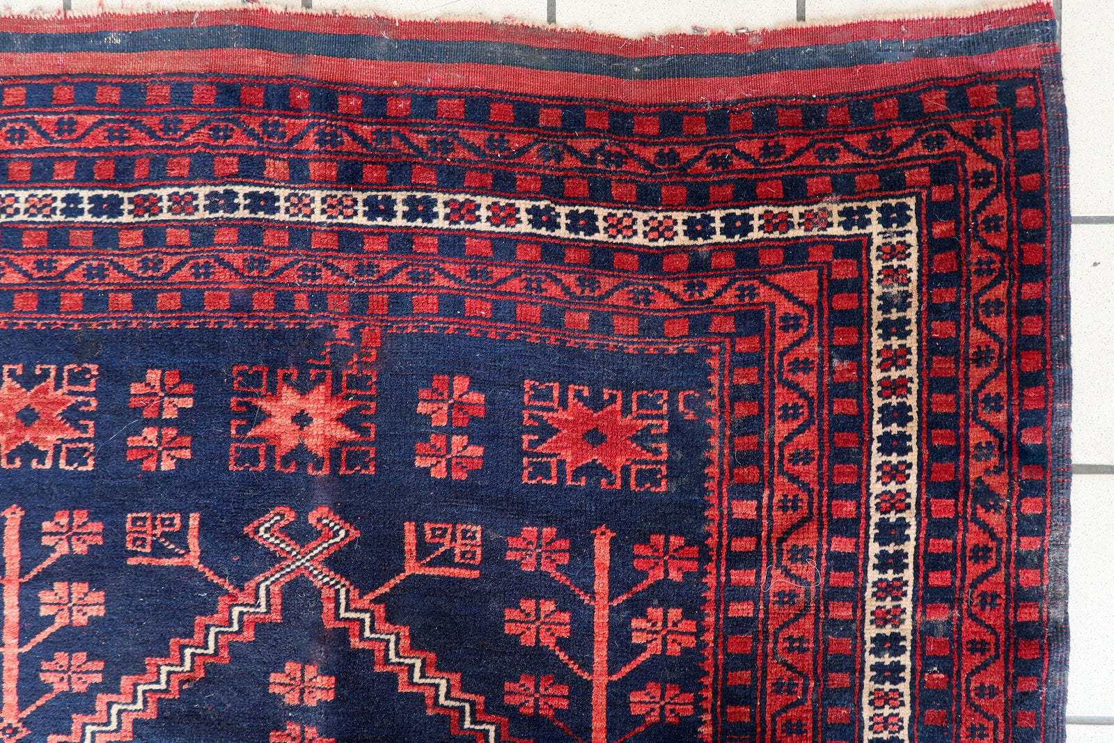 Close-up of Karabagh Rug Corner - Navy Blue and Red Wool Threads