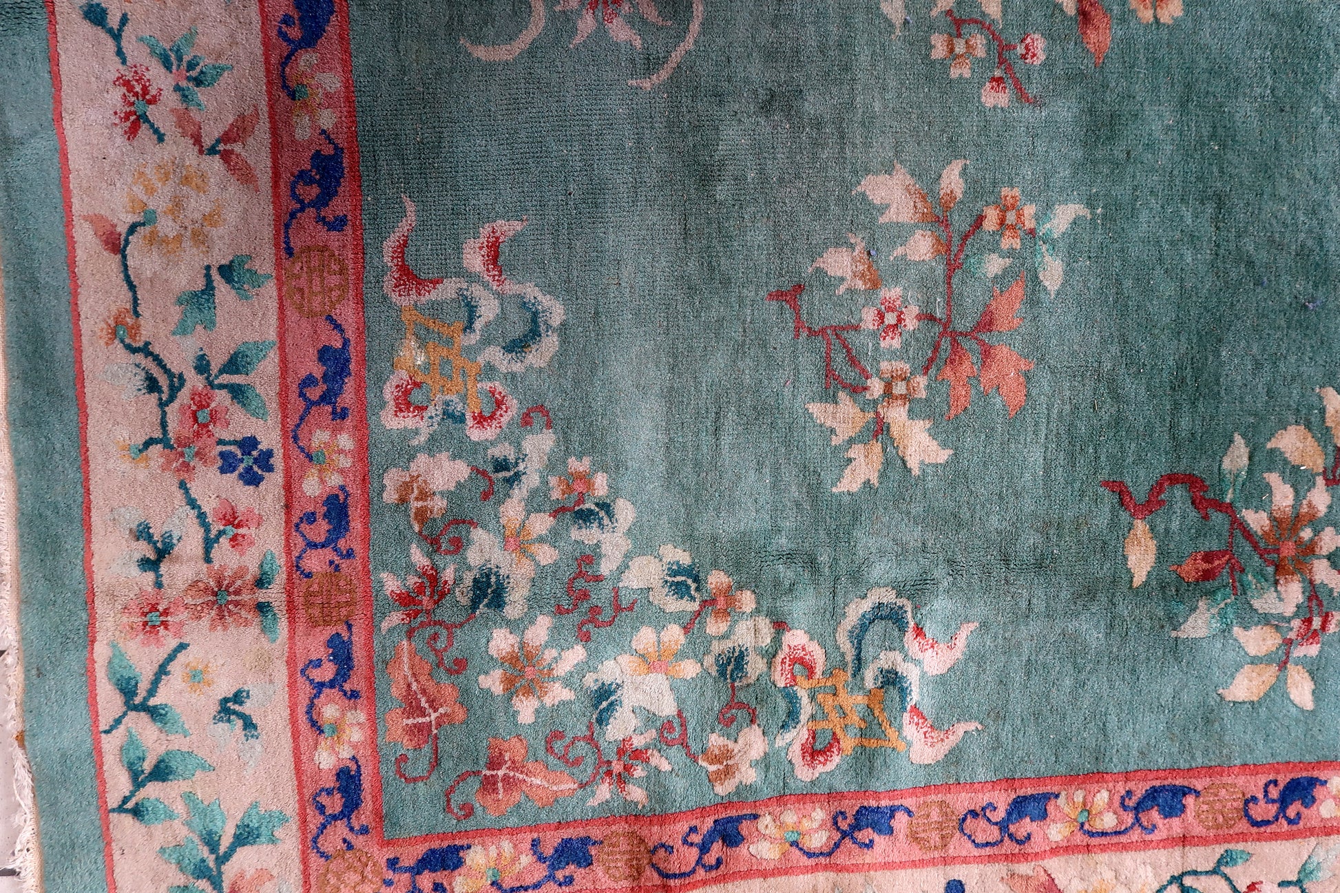 A corner of the rug showcasing its classic design.